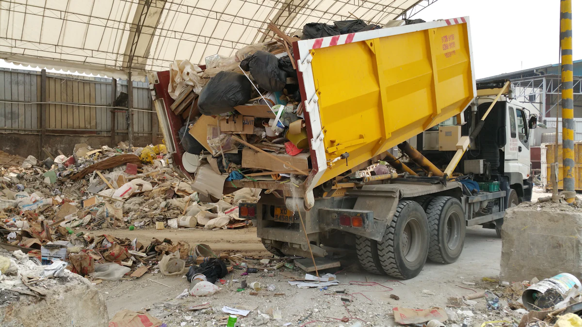 Yellow truck tipping mixed waste at a transfer facility